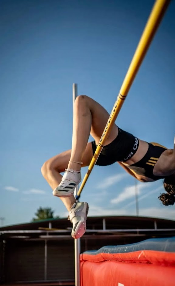 Athlete clearing high jump bar